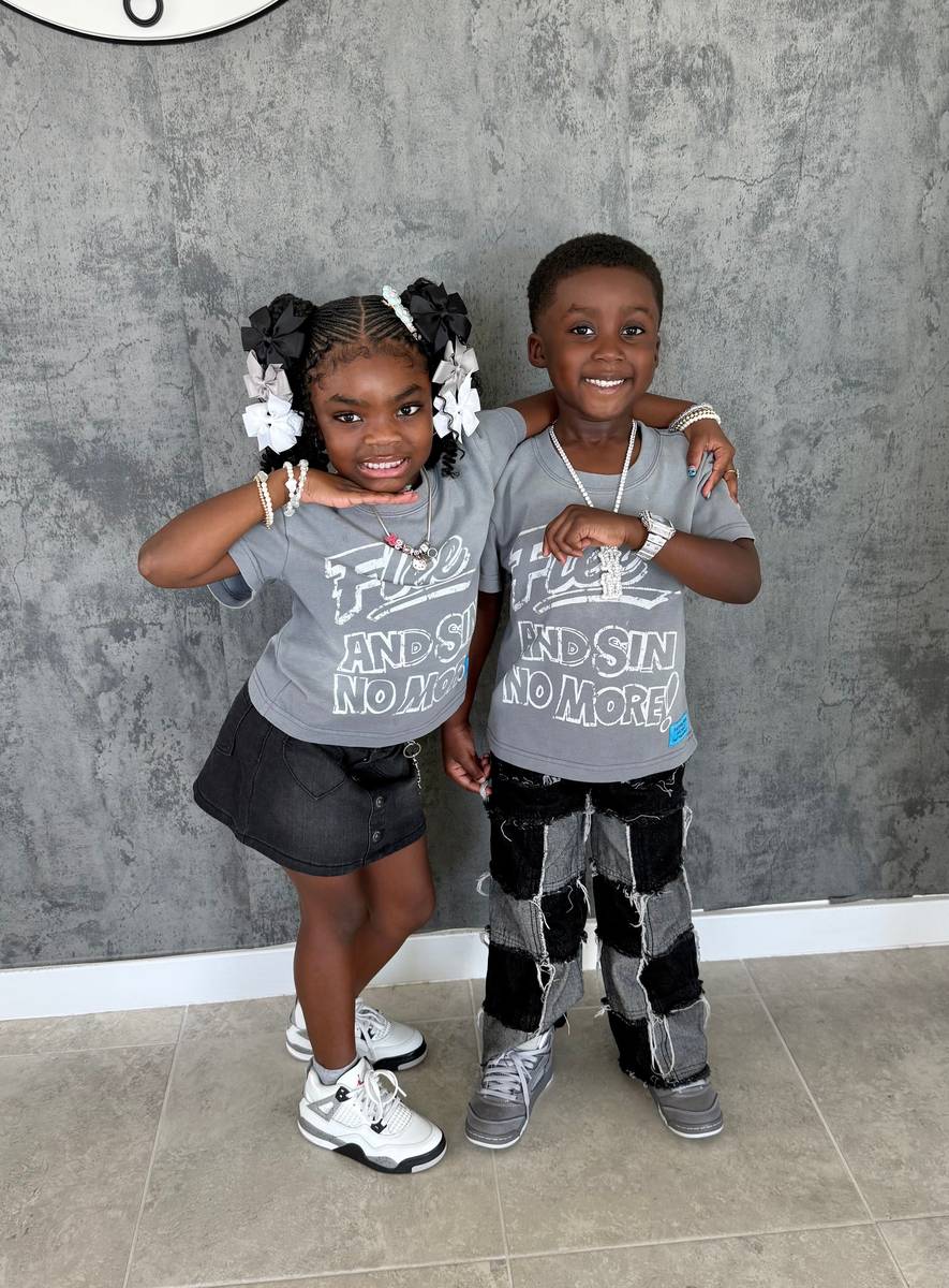 Two kids wearing the kids Flee tee