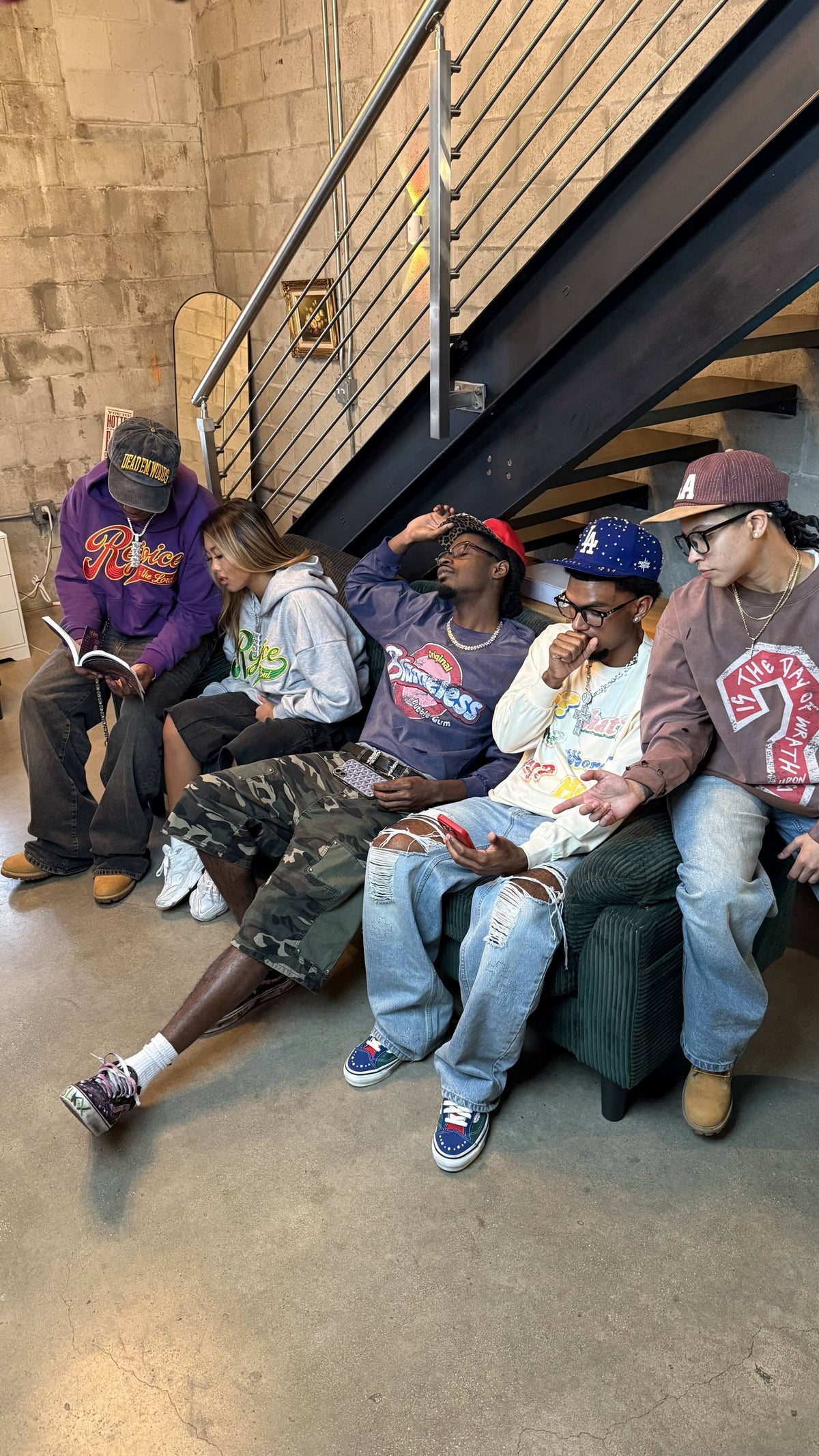 Five people in Faith Based District pieces sitting under a stairway